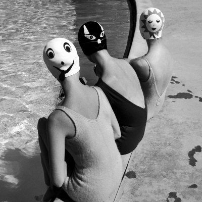 Women Modeling Bathing Caps with Faces on Them Stretched Canvas Print