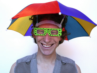 young-man-in-an-umbrella-hat-waits-for-rain.jpg