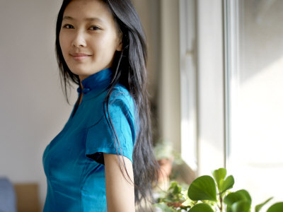 Chinese Girl on Young Chinese Woman Wearing A Traditional Chinese Blue Cheongsam