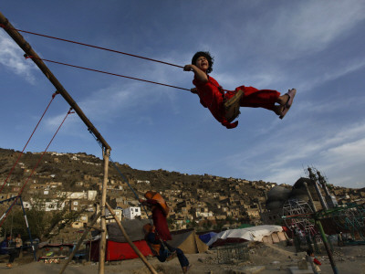 kabul girls dance. Afghan Girl Plays on a Swing