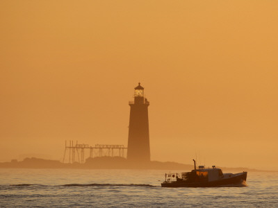 Lobster Boat Passes Ram Island Ledge Light at Dawn Off Cape Elizabeth, Maine Stretched Canvas Print