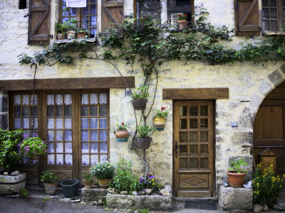 House Facade with Flowers in Lot Valley Stretched Canvas Print