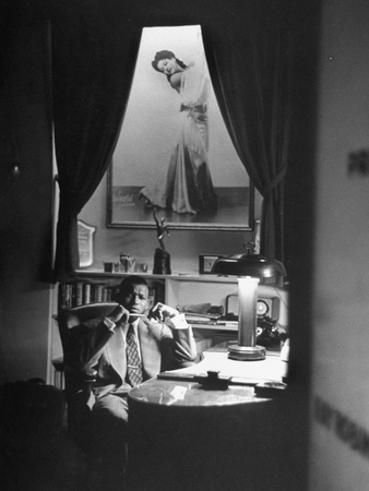 Sugar Ray Robinson Sitting in His Office under a Life-Size Portrait of His Wife Stretched Canvas Print