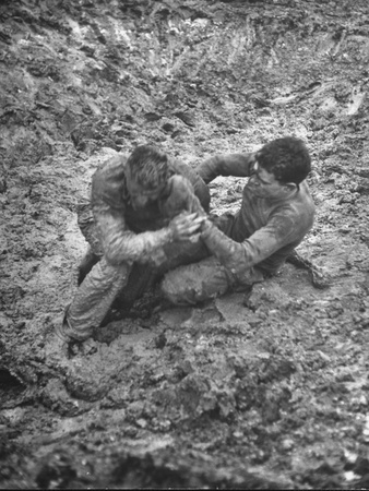 Mud-Covered Men Struggling in Mid-Field During Battledown Stretched Canvas Print