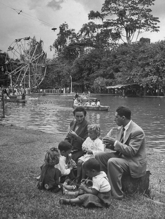 Family Having a Picnic in the Park Stretched Canvas Print