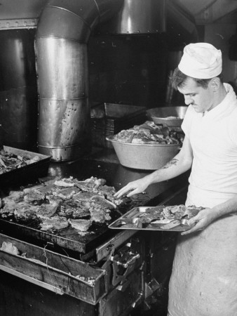 A Sailor Cooking Meat for the Crew Aboard a US Navy Cruiser Stretched Canvas Print