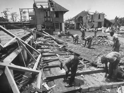 Comeback Begins by Clearing Debris, Drying Bed Linen at the Wrecked Hospital Stretched Canvas Print
