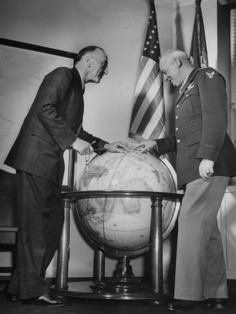 A View of Arnold Rickenbacker Talkng to a General over a Globe Stretched Canvas Print