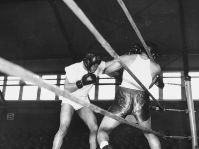Boxer Joe Louis Fighting in Boxing Match Stretched Canvas Print