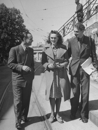 Stephen Spender and Denis De Rougemont Talking to a Lady Stretched Canvas Print