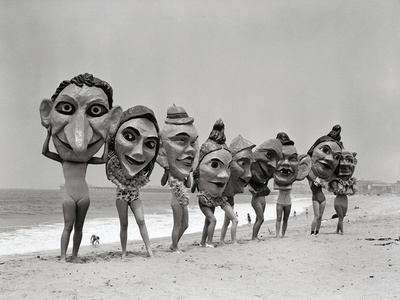 Women Holding Giant Masks Stretched Canvas Print