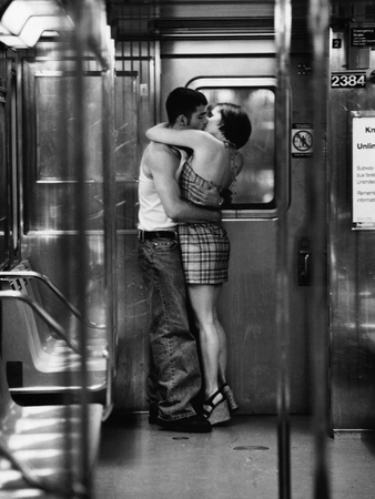Passionate Couple Kissing in Subway Car Stretched Canvas Print