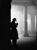 Silhouette of Man Lighting Pipe