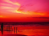 Surf Rolling onto Beach at Sunset
