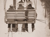 Skiers Riding Chair Lift