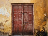 Wooden Door in Worn Wall