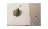Lone Pear on White Paper and Newsprint