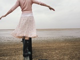 Woman Balancing on a Breakwater
