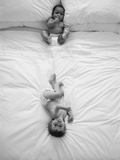 Two Babies Lying on Bed