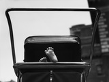 Baby's Feet Peeking out of Carriage