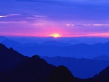 Rosy Sky at Dawn over a Vast Mountain Range