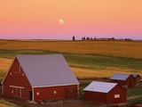 Sun Setting Behind Barns
