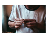 Hands on a cigar