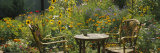 Empty Chairs and a Table in a Garden  Taos  New Mexico  USA