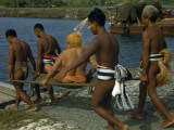 Men Carry a Chief Seated on a Litter