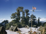 Naturalist Sits in Camp Working on Her Notes  Porter Stands Nearby