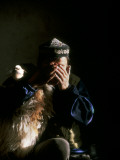 A Young Kazakh Man Gives Thanks to Allah before Slaughtering a Sheep