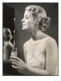 Lady in Her Slip Putting on Her Perfume Before Dressing