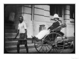 Man Wearing a Pith Helmet Being Transported by Rickshaw Probably in India