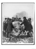 Group of Schoolboys and Girls in Caps Hats and Overcoats Rolling a Dirty Great Snowball!
