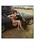 Girl in a Classic Racing Green "MGB" Sports Car