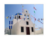 Chuch with flags in the city of Oia on Santorini