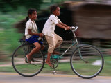 Girls Riding Bicycle in Bavel Village  Battambang  Cambodia