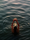Woman Pouring Water During Morning Puja on Ganges  Varanasi  India