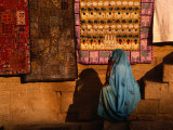 Woman in Sari Sitting in Front of Rugs for Sale  Jaisalmer  Rajasthan  India