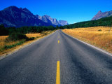 Road with Mountain Range in Distance Glacier National Park  Montana  USA
