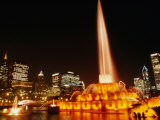 Gold Lights of Buckingham Fountain in Grant Park with City Skyline in Background  Chicago  USA
