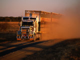 Road Train Driving along Dusty Road  Kynuna  Australia
