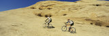 Two Men Mountain Bilking on Rocks  Slickrock Trail  Moab  Utah  USA