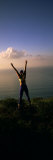 Young Woman Exercising on a Hill