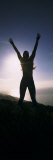 Young Woman Exercising on a Hill
