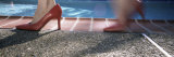 Woman's Feet in High Heel Shoes Walking along a Swimming Pool  California  USA