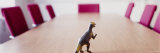 Dinosaur Toy on a Conference Table