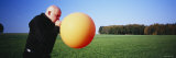 Mature Man Blowing a Balloon  Germany