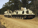An M-88 Recovery Vehicle Begins to Tow an M992 Field Artillery Ammunition Supply Vehicle