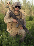 Saqlawiyah  Iraq  a Combat Engineer Assumes a Kneeling Position as He Provides Security in a Field